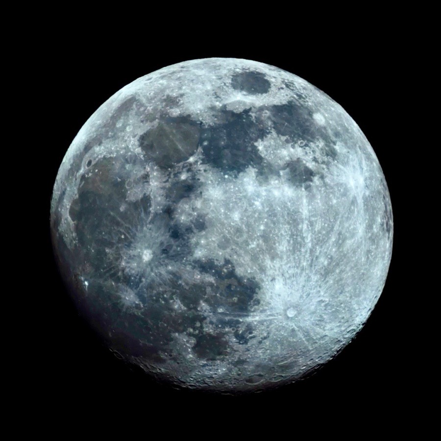 Detailed view of the nearly full Moon against a black sky